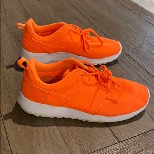 Orange and White Nike Roshe sneakers